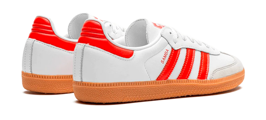 Scarpe da ginnastica bianche e rosse collezione Adidas